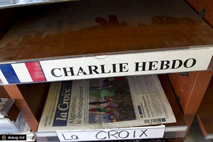 Charlie Hebdo изобразил раненого парижанина танцующим и пьющим шампанское